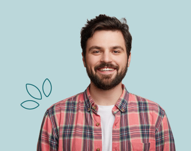 A guy with beard smiling |Cannabis Doctors Australia | Balnce